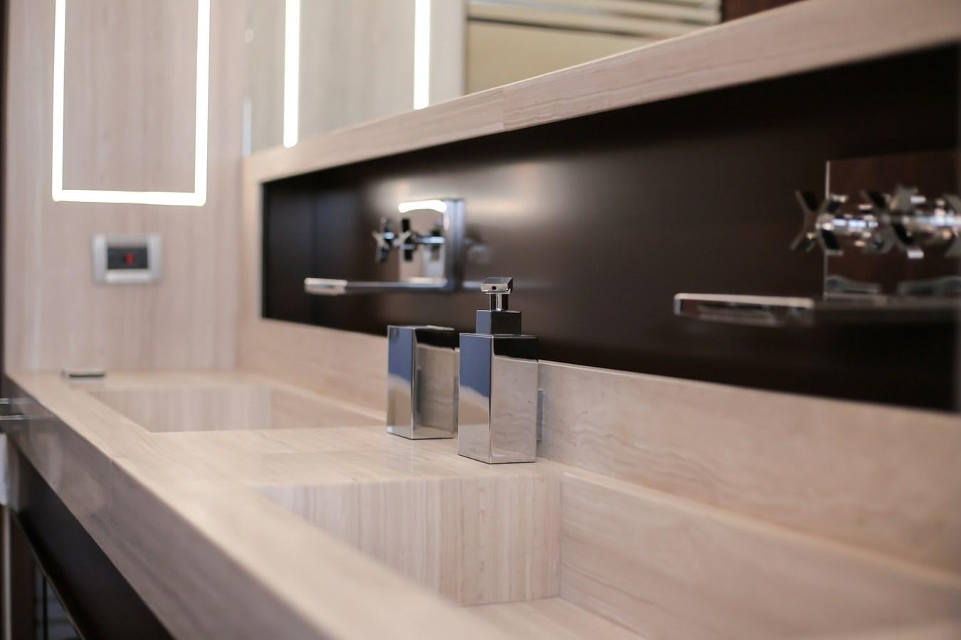 a bathroom with a sink and mirror aboard SEDA Yacht for Sale