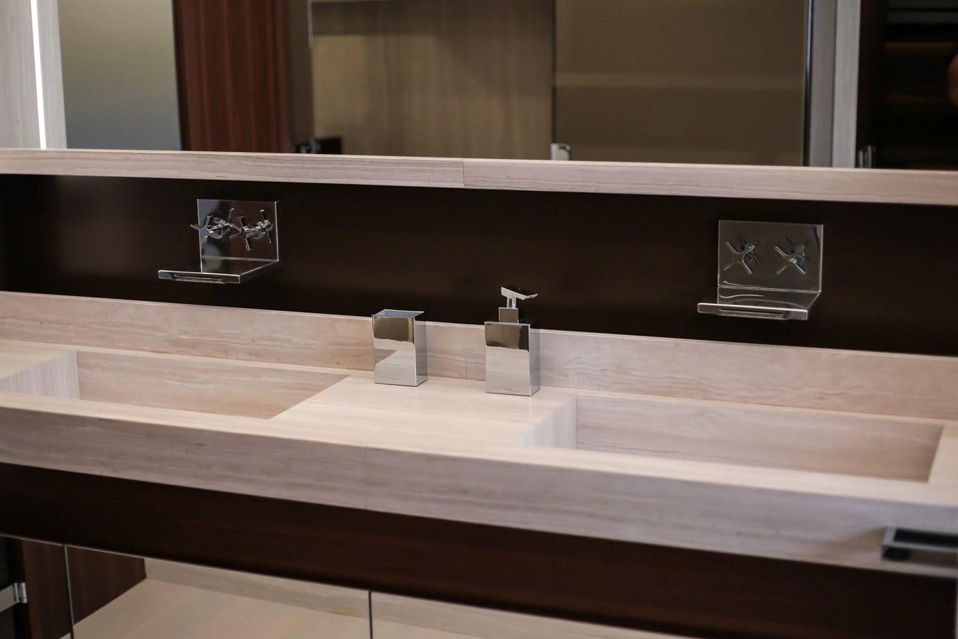 a bathroom sink with a mirror above it aboard SEDA Yacht for Sale