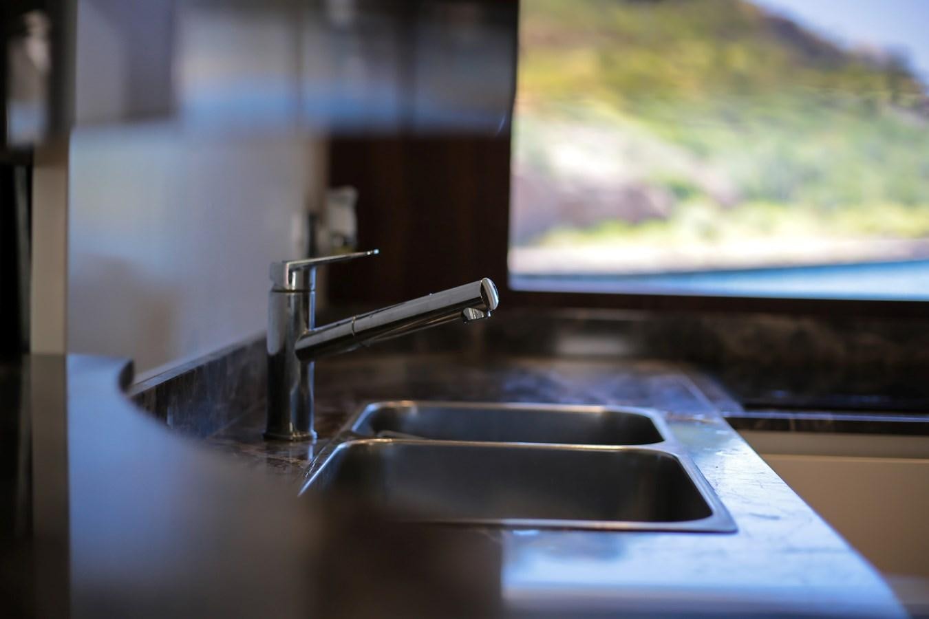 a sink with a tv in the background aboard SEDA Yacht for Sale