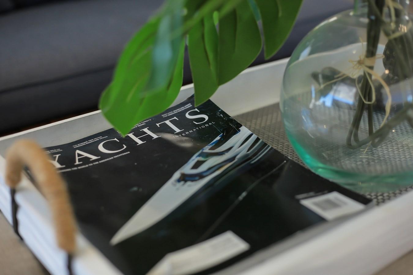 a hand holding a book aboard SEDA Yacht for Sale