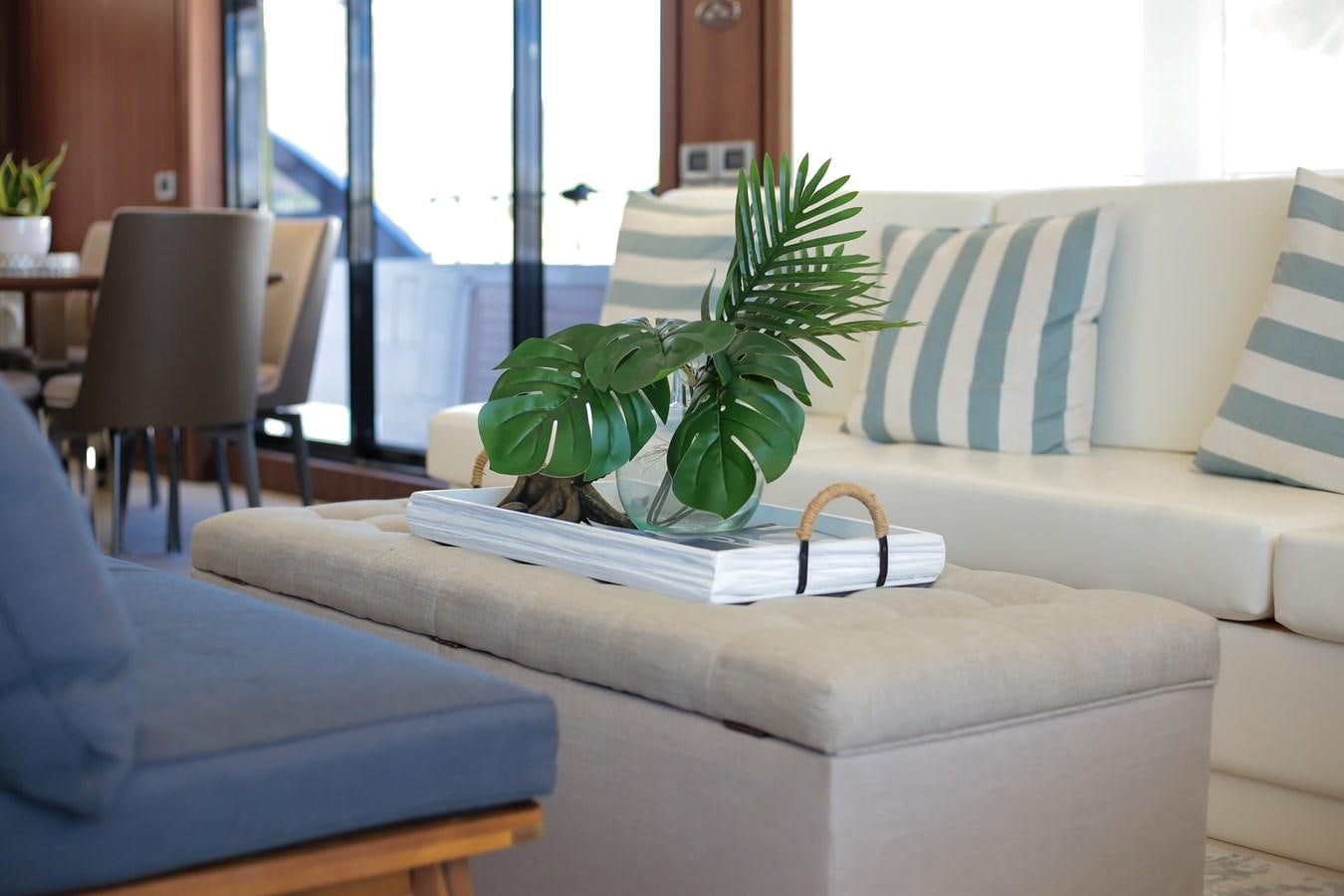a couch with a plant on it aboard SEDA Yacht for Sale