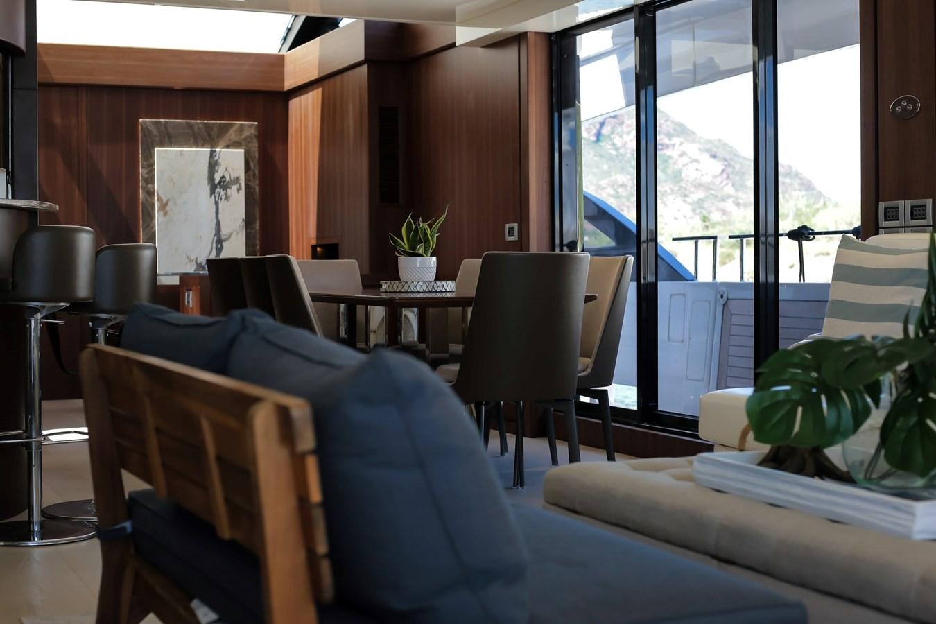 a room with a table and chairs aboard SEDA Yacht for Sale