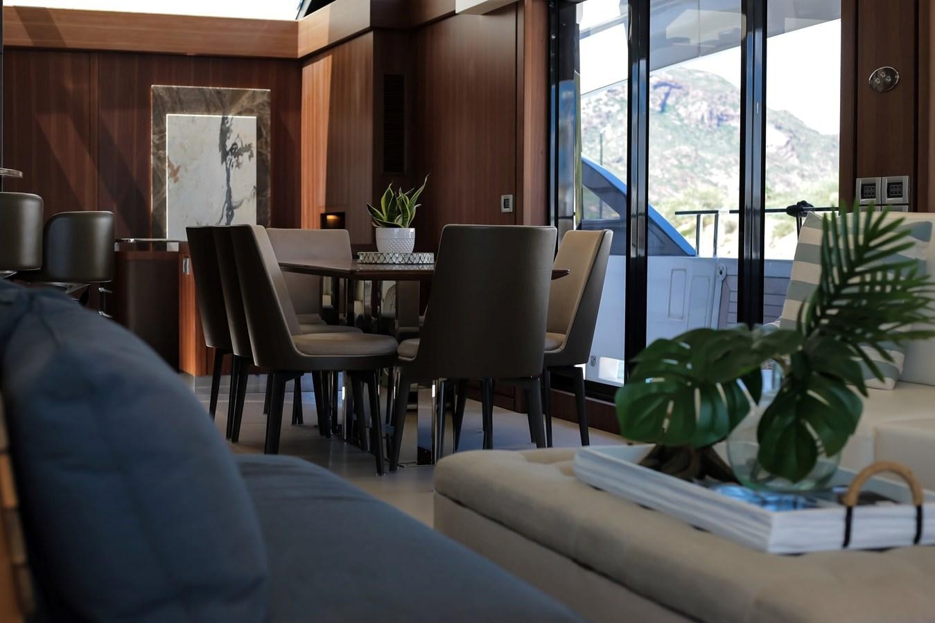 a room with a table and chairs aboard SEDA Yacht for Sale