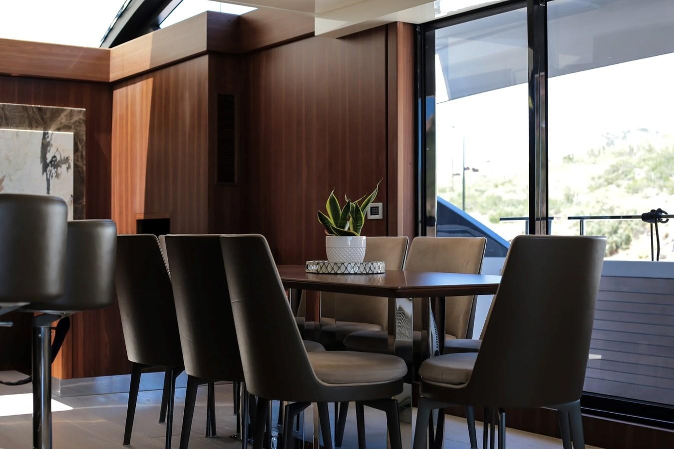 a room with a table and chairs aboard SEDA Yacht for Sale