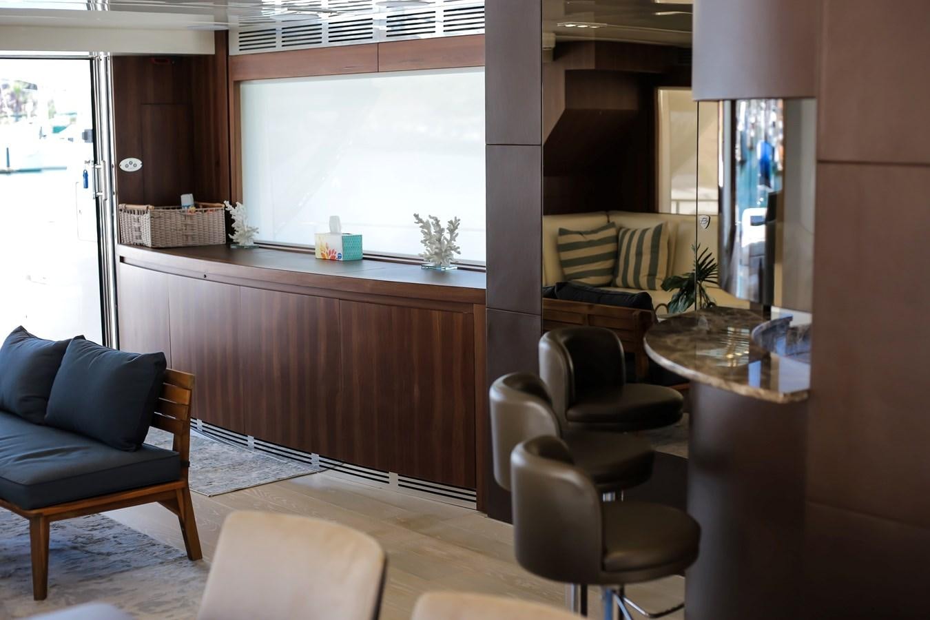 a living room with a couch and a table aboard SEDA Yacht for Sale