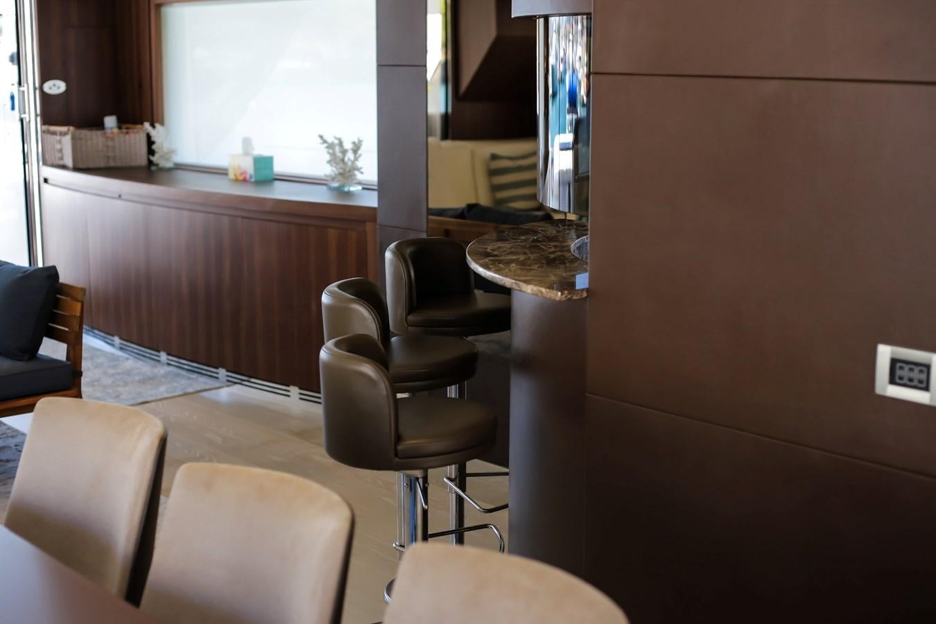 a room with chairs and a table aboard SEDA Yacht for Sale