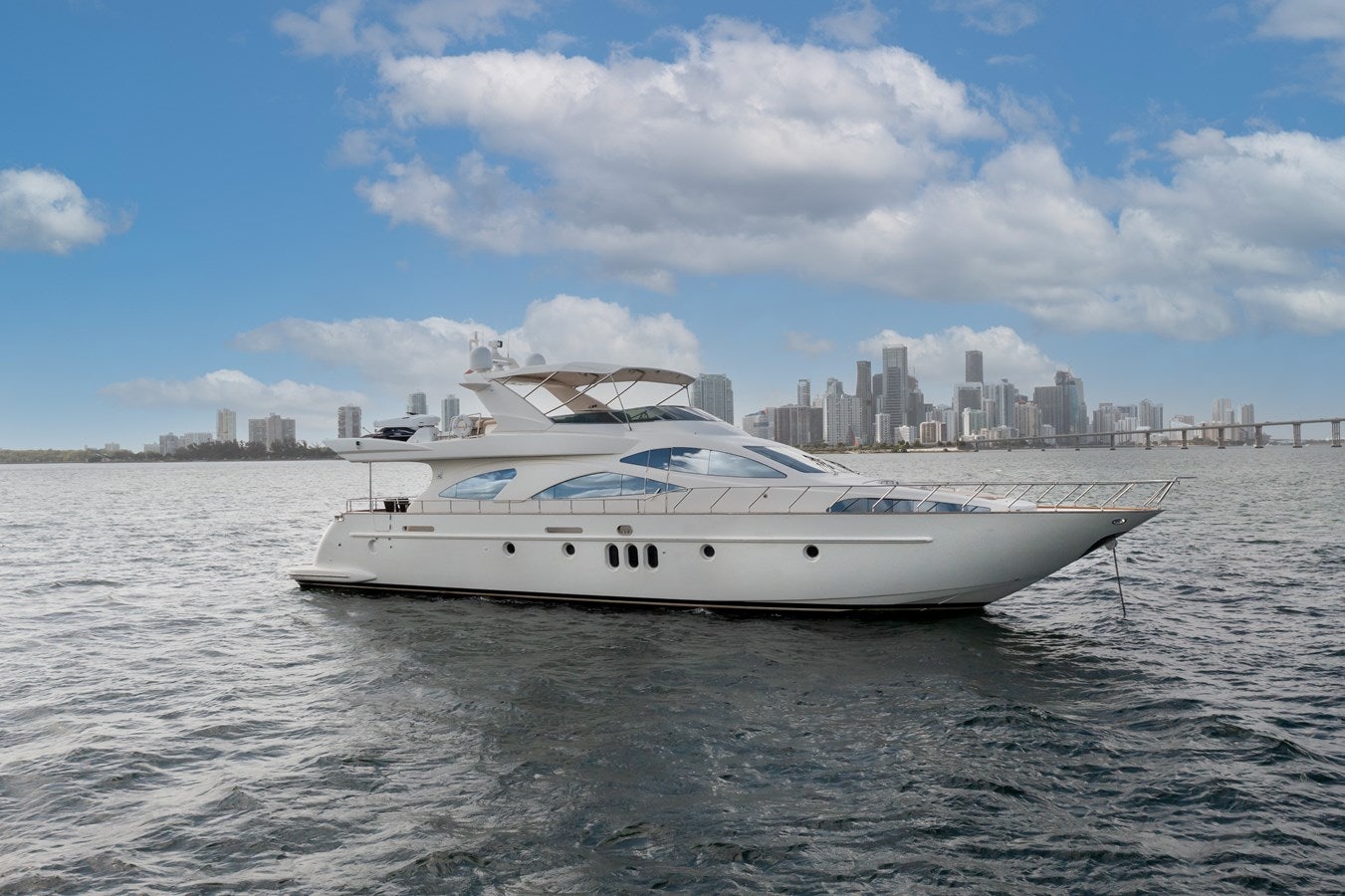 a white yacht on the water aboard AZIMUT 80 2003 Yacht for Sale