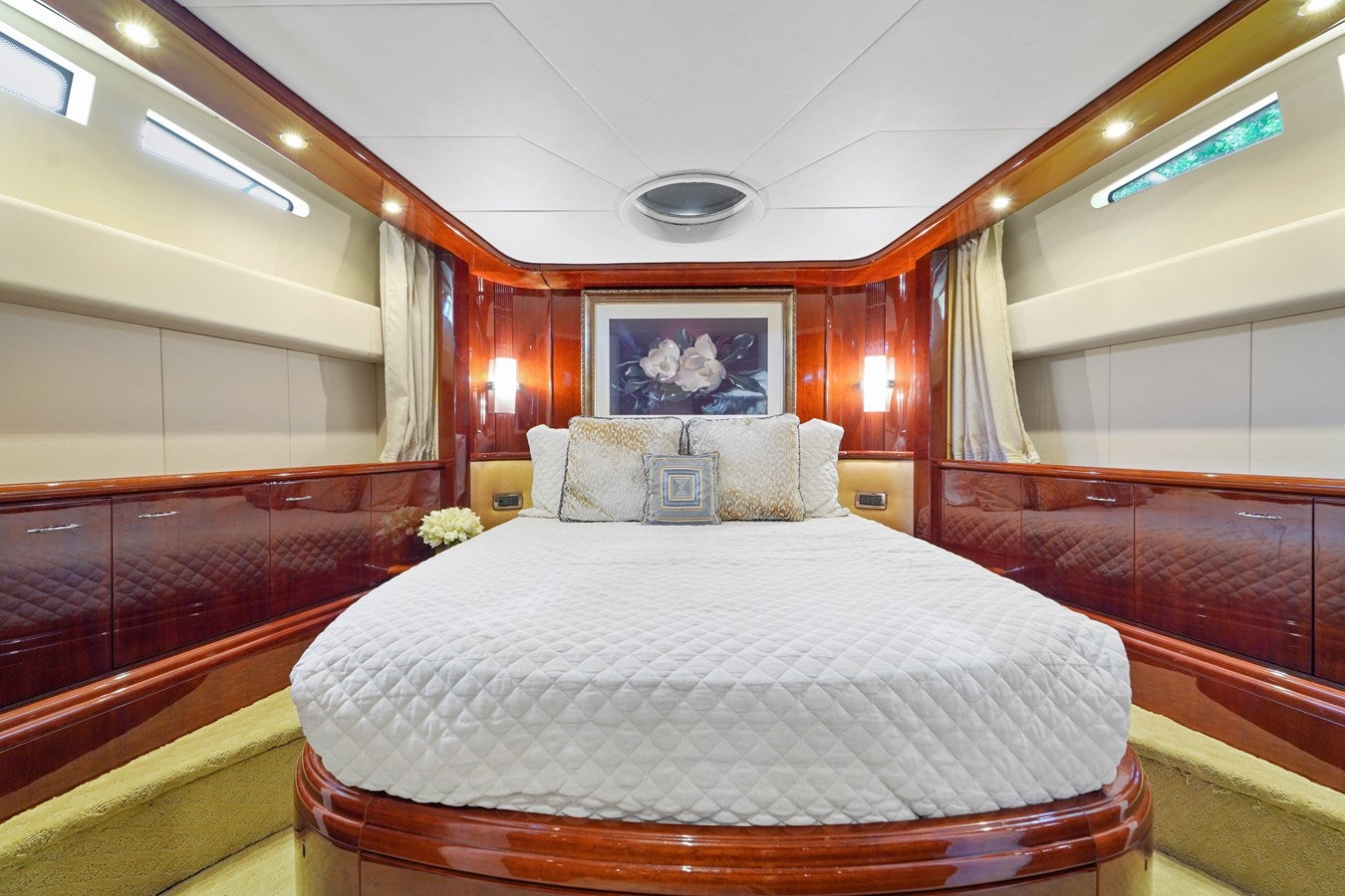 a bed in a room aboard AZIMUT 80 2003 Yacht for Sale