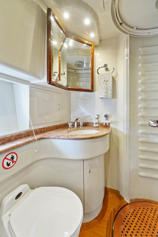 a bathroom with a sink and a toilet aboard AZIMUT 80 2003 Yacht for Sale