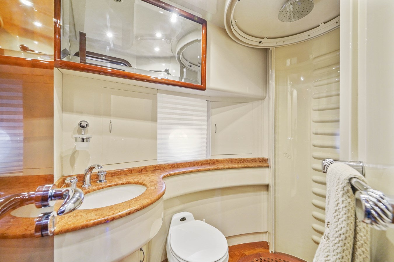 a bathroom with a sink and a mirror aboard AZIMUT 80 2003 Yacht for Sale