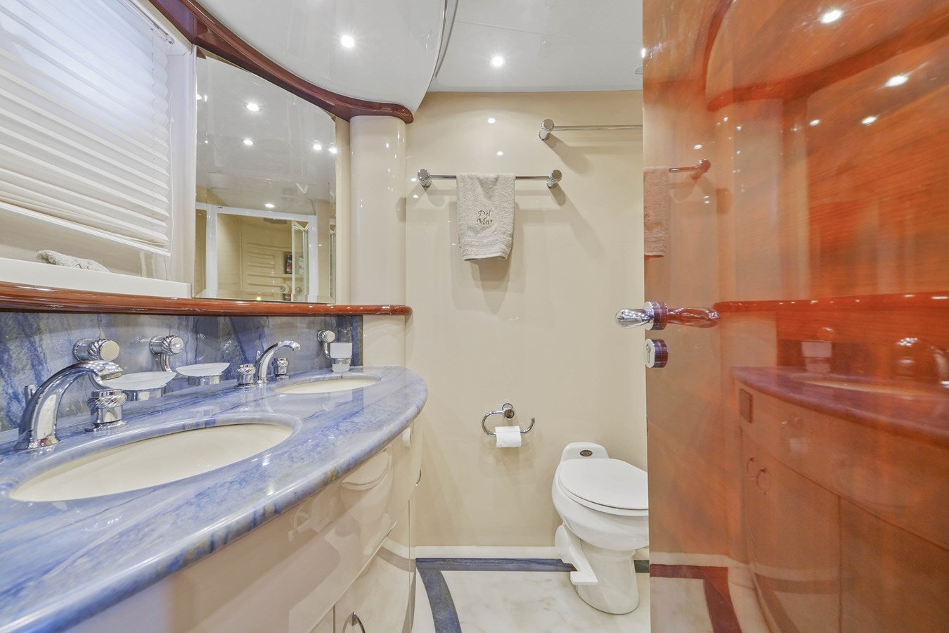 a bathroom with a sink toilet and a mirror aboard AZIMUT 80 2003 Yacht for Sale