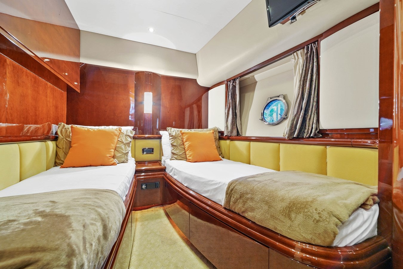 a room with beds and a tv aboard AZIMUT 80 2003 Yacht for Sale