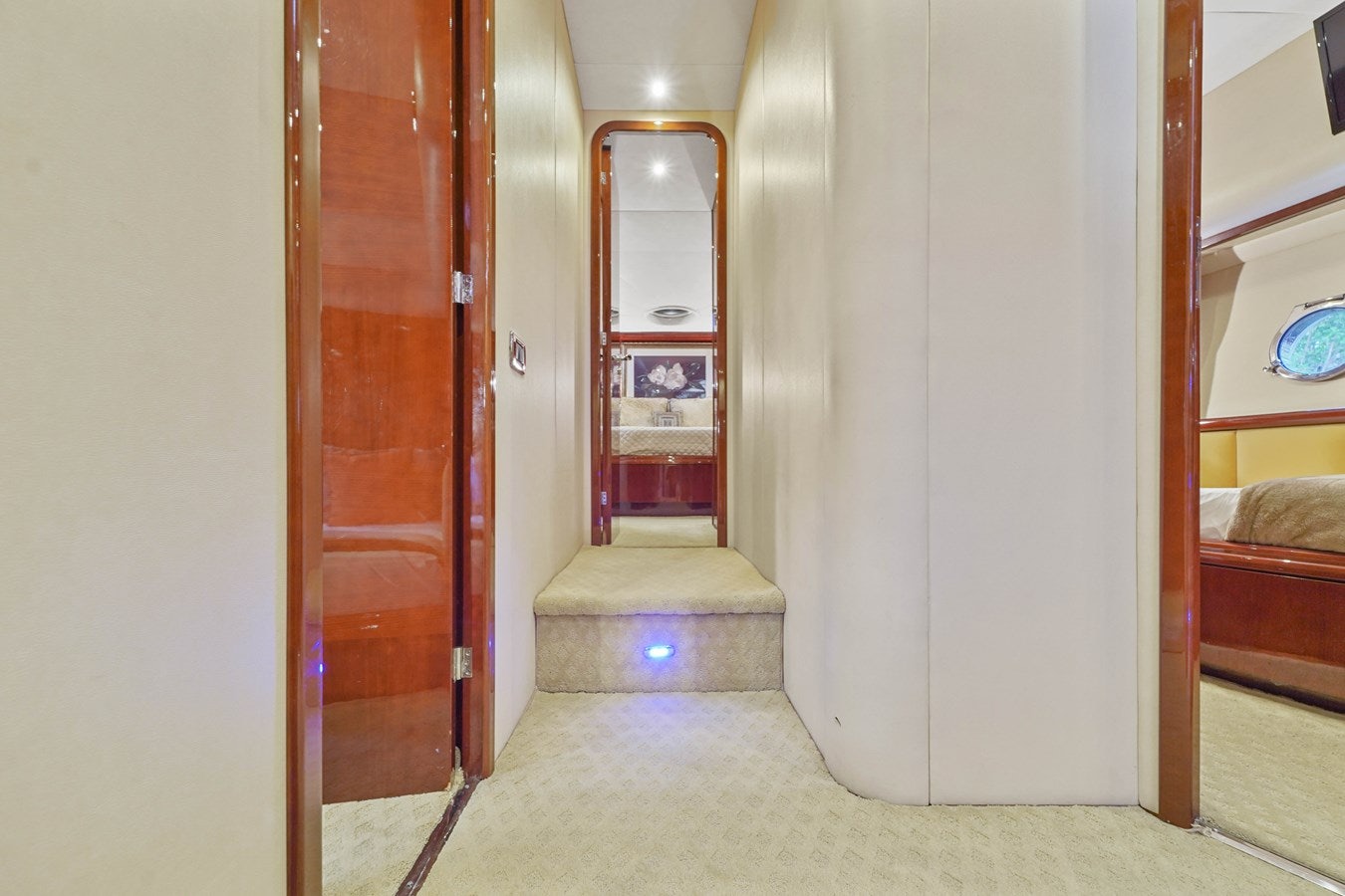 a room with a door and a mirror aboard AZIMUT 80 2003 Yacht for Sale