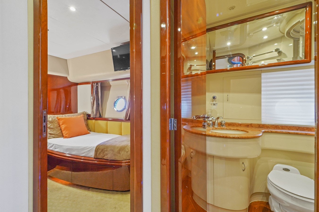 a bathroom with a sink and a bed aboard AZIMUT 80 2003 Yacht for Sale