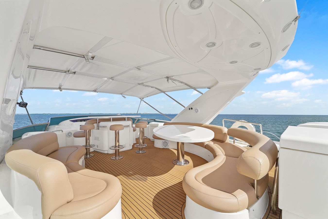 a room with a table and chairs aboard AZIMUT 80 2003 Yacht for Sale
