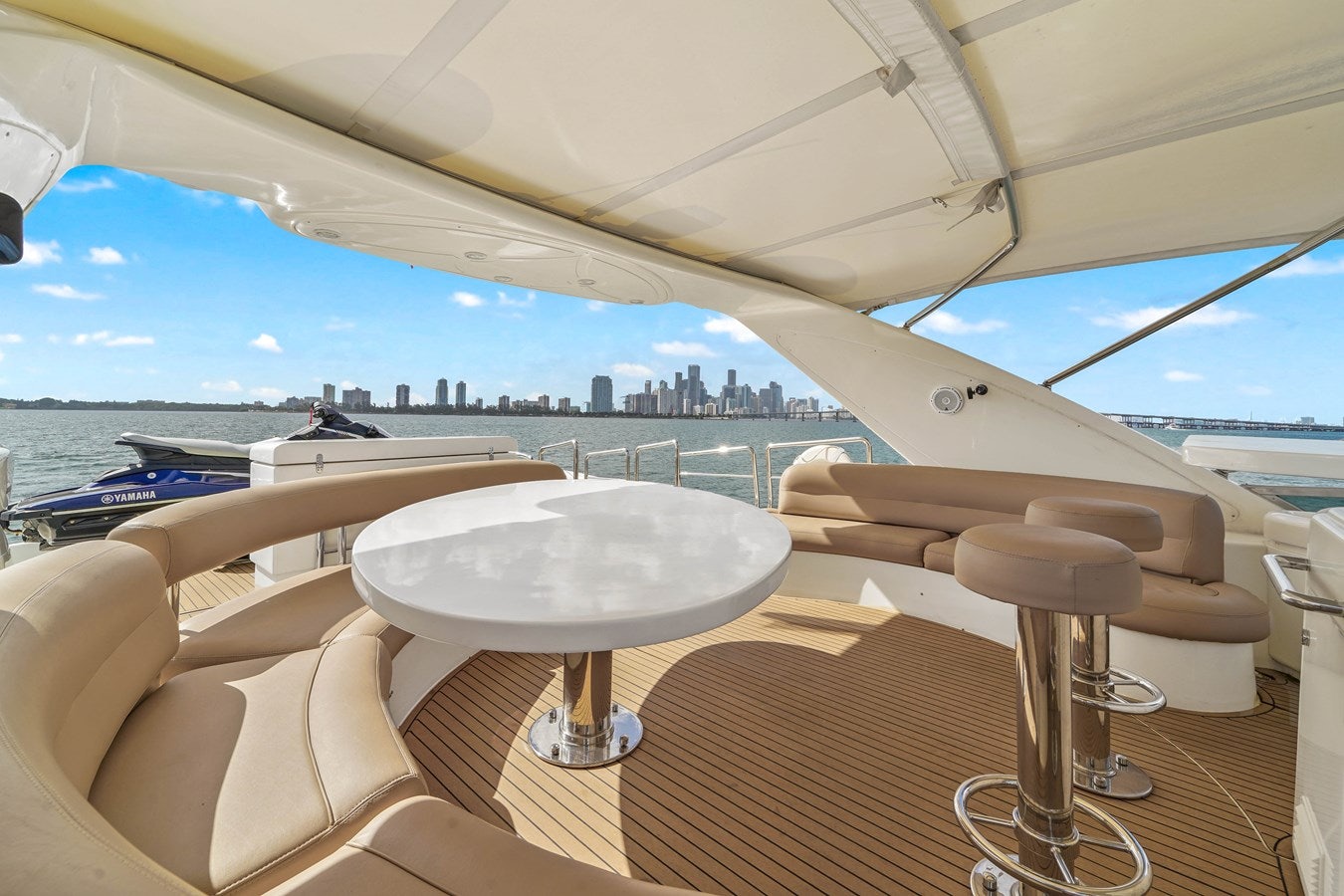 a table and chairs on a patio aboard AZIMUT 80 2003 Yacht for Sale