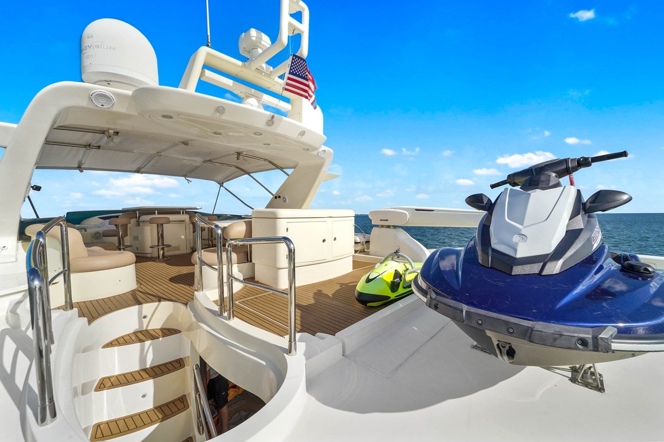 a boat with a flag on the deck aboard AZIMUT 80 2003 Yacht for Sale