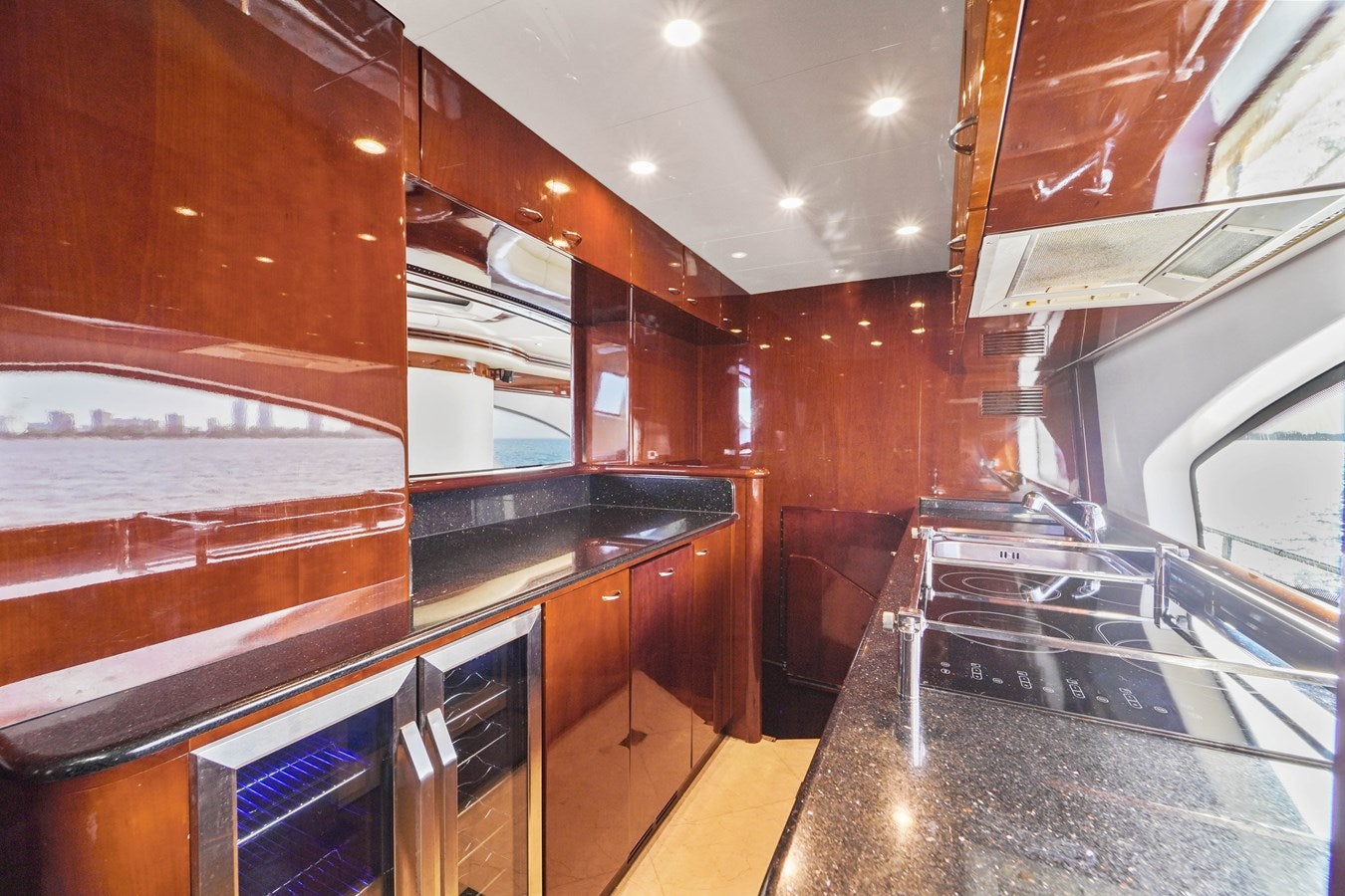 a kitchen with stainless steel appliances aboard AZIMUT 80 2003 Yacht for Sale