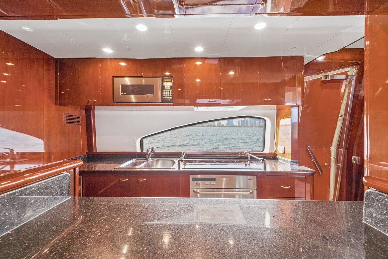 a kitchen with a large glass window aboard AZIMUT 80 2003 Yacht for Sale