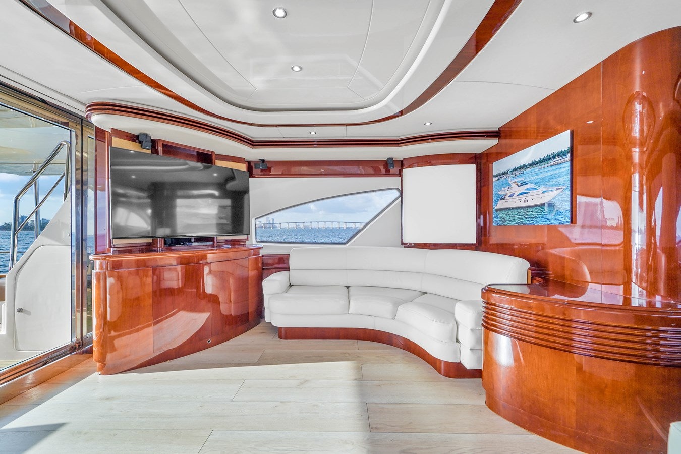 a room with a couch and a television aboard AZIMUT 80 2003 Yacht for Sale