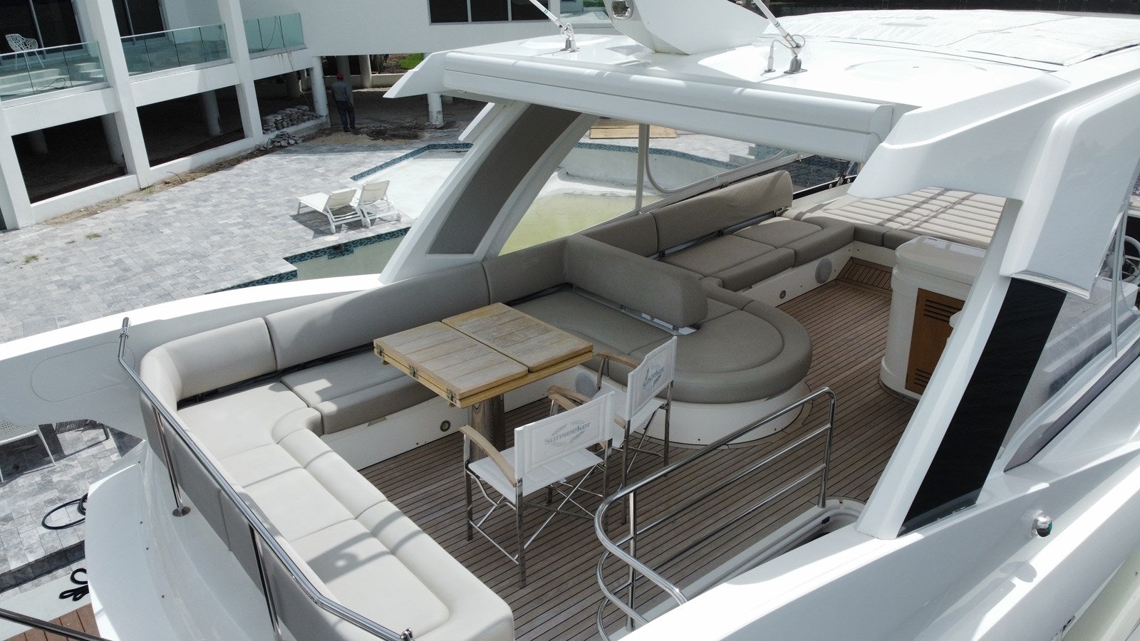 a large white boat with a wooden dock aboard 66 MANHATTAN Yacht for Sale