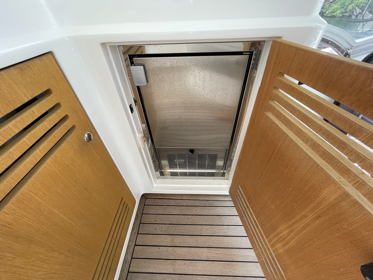 a wooden staircase leading to a window aboard 66 MANHATTAN Yacht for Sale