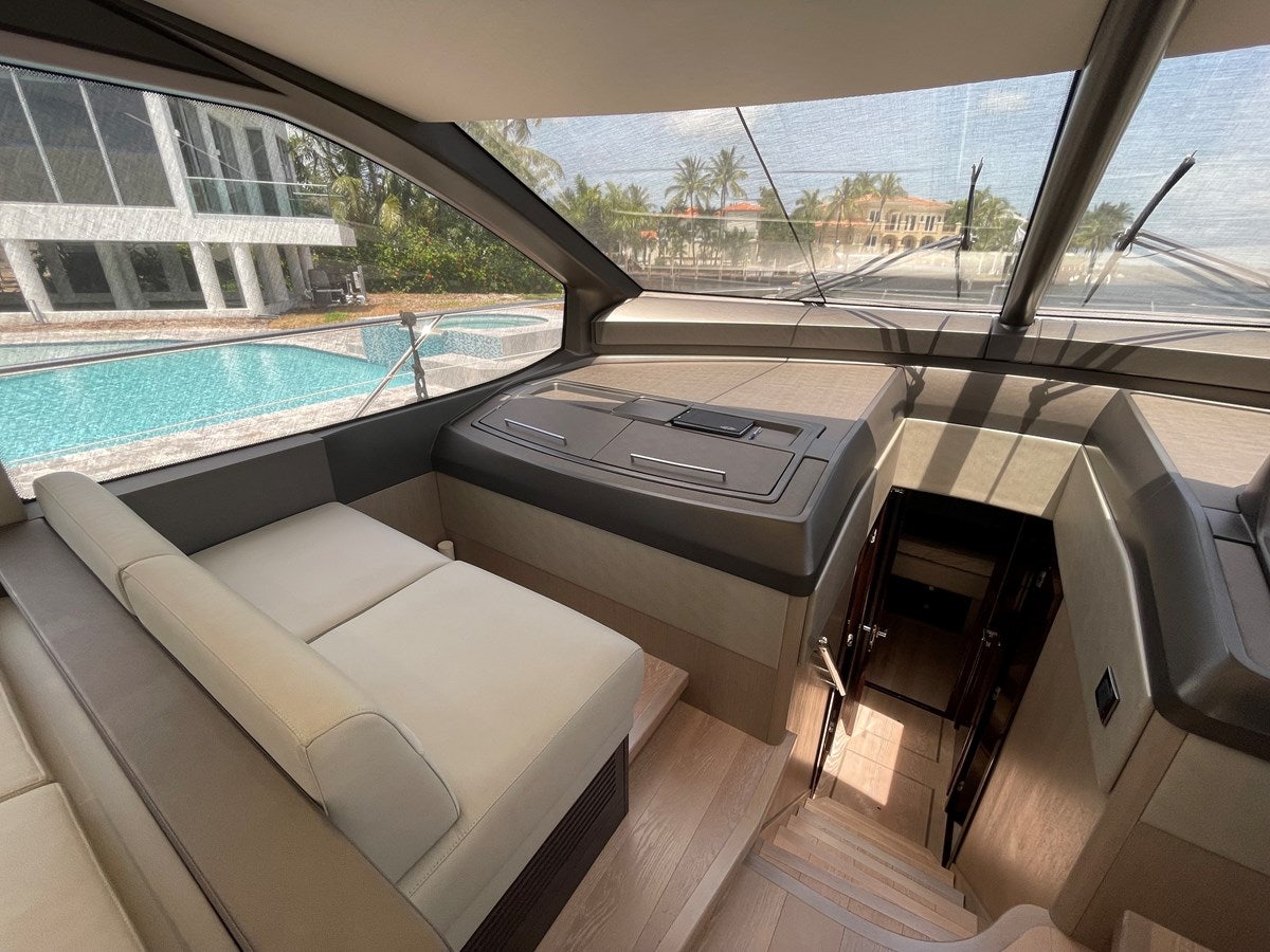 a room with a couch and a pool aboard 66 MANHATTAN Yacht for Sale