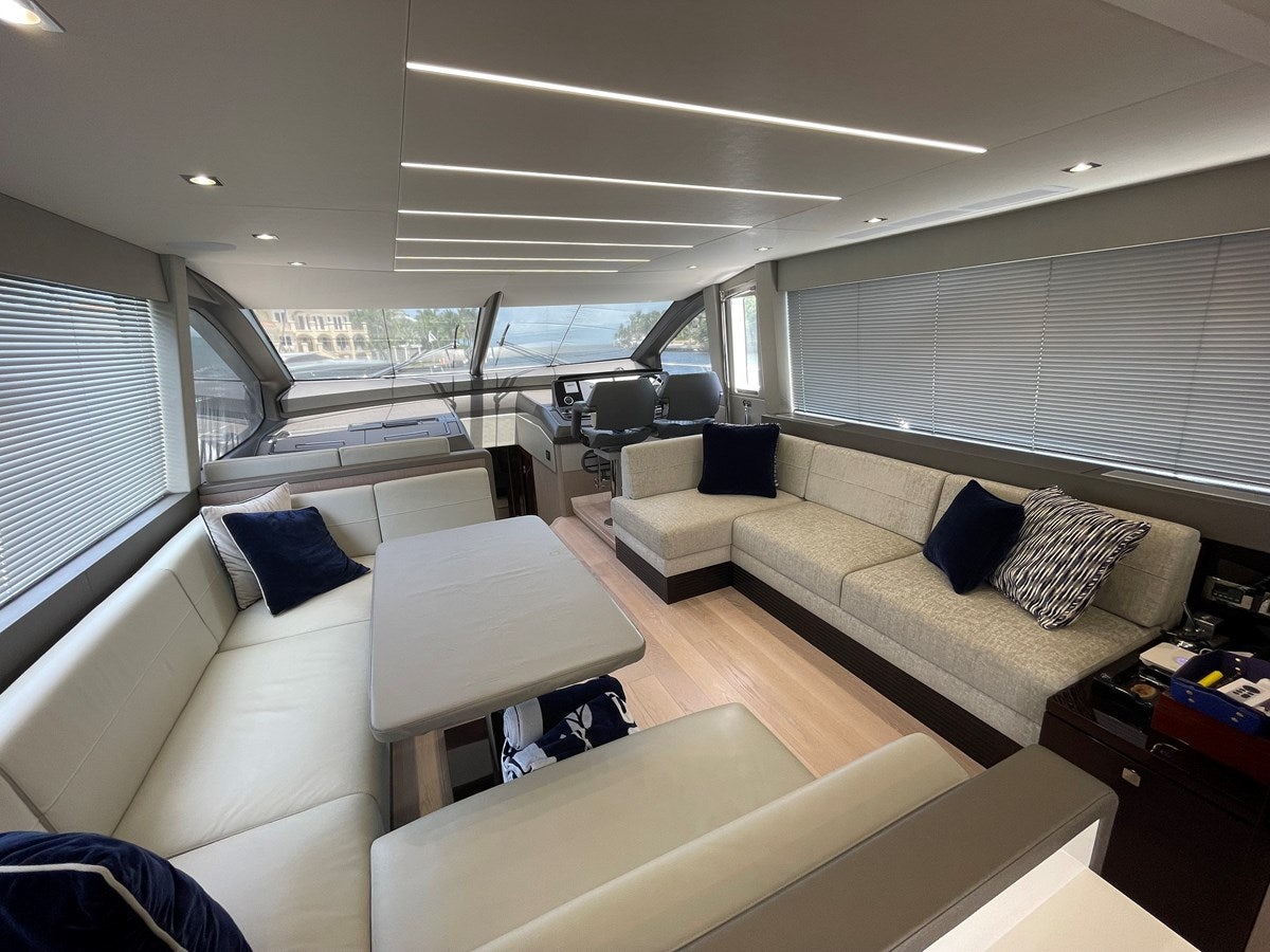 a living room with a couch and a table aboard 66 MANHATTAN Yacht for Sale