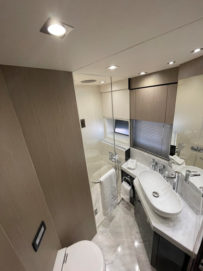 a bathroom with a large mirror aboard 66 MANHATTAN Yacht for Sale