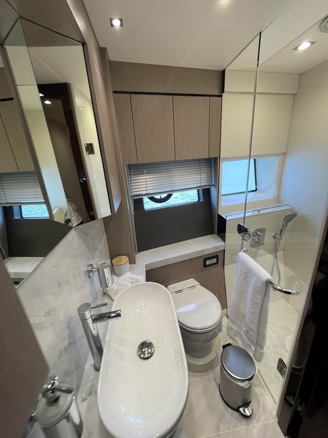 a bathroom with a large television aboard 66 MANHATTAN Yacht for Sale