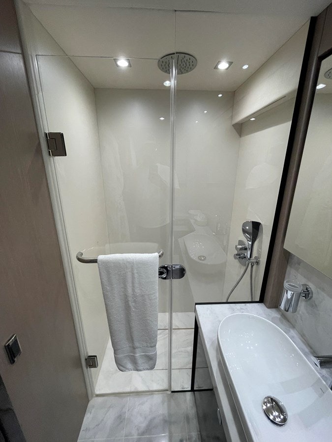 a bathroom with a glass shower aboard 66 MANHATTAN Yacht for Sale
