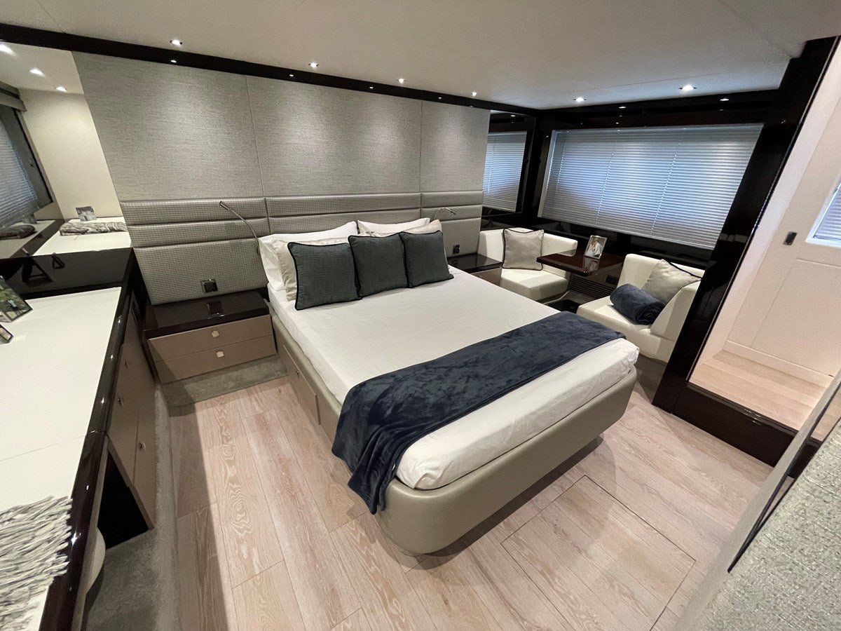 a room with a bed and a tv aboard 66 MANHATTAN Yacht for Sale