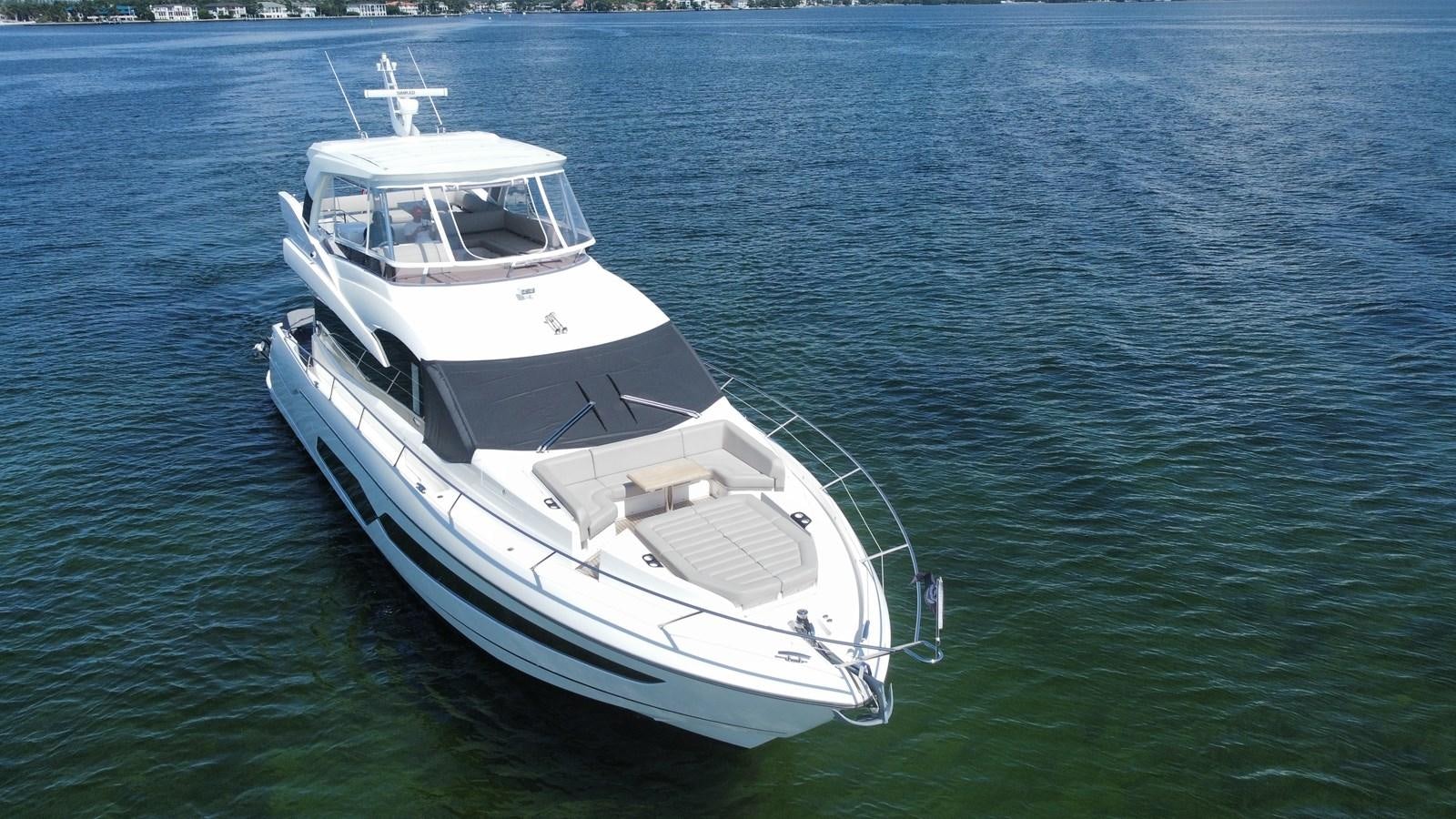 a white boat in the water aboard 66 MANHATTAN Yacht for Sale