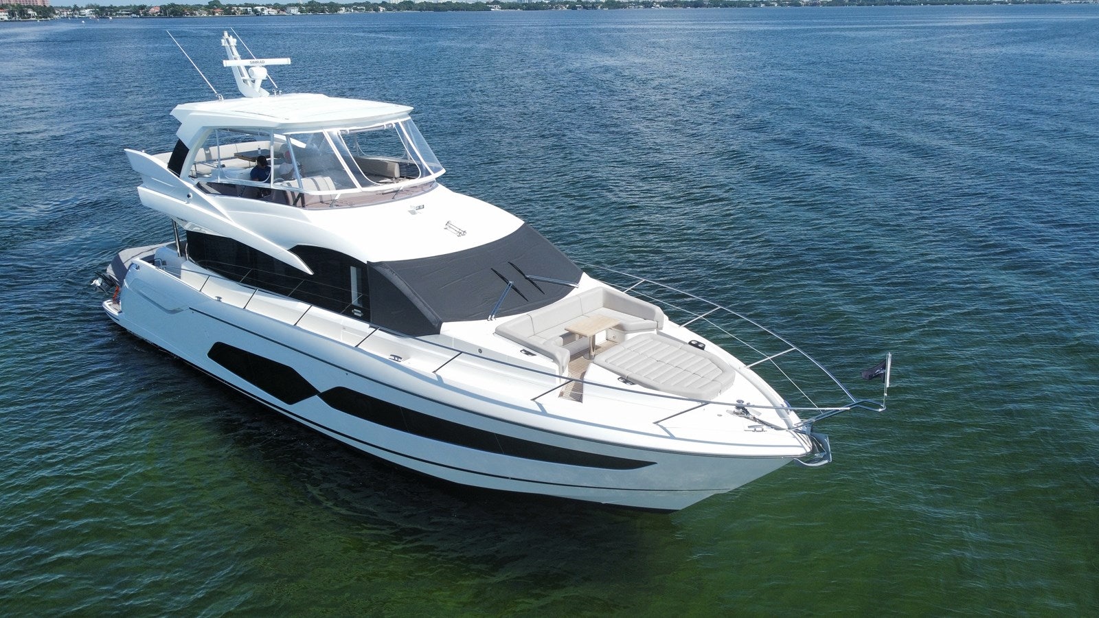 a white boat in the water aboard 66 MANHATTAN Yacht for Sale