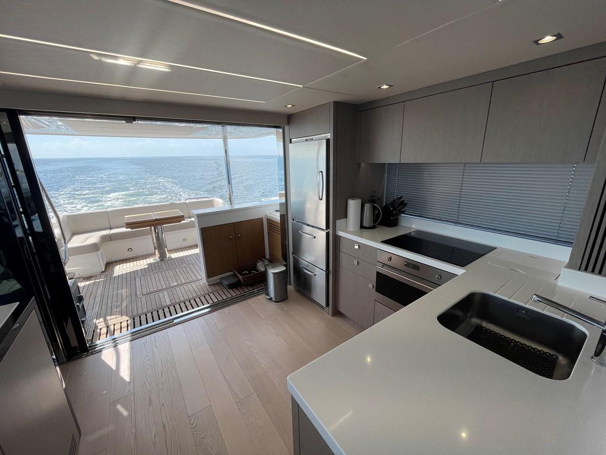 a kitchen with a large window aboard 66 MANHATTAN Yacht for Sale