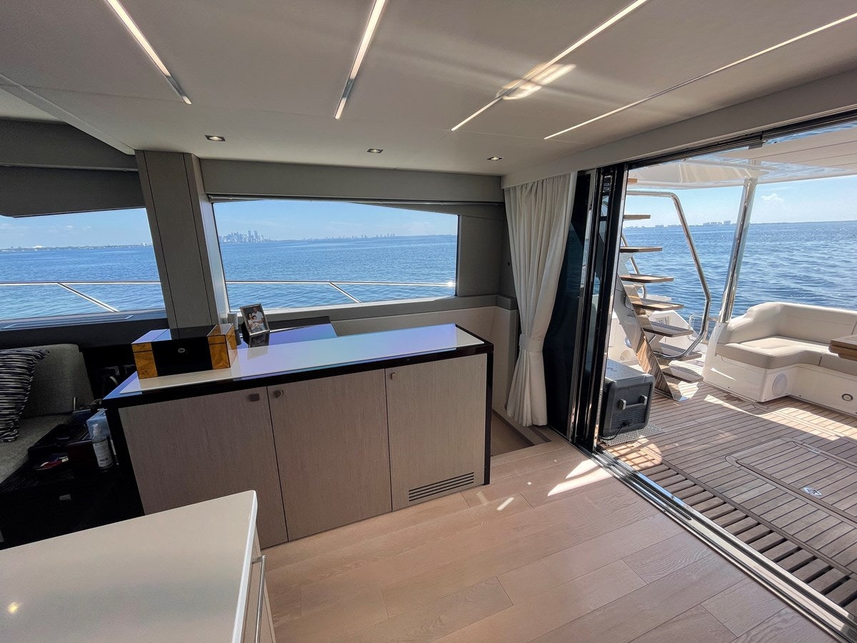 a room with a view of the ocean and a deck aboard 66 MANHATTAN Yacht for Sale
