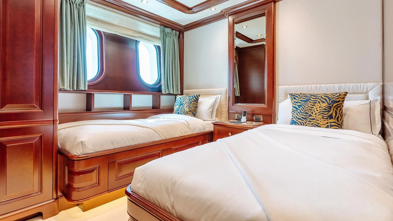 a room with two beds aboard INCAL Yacht for Sale
