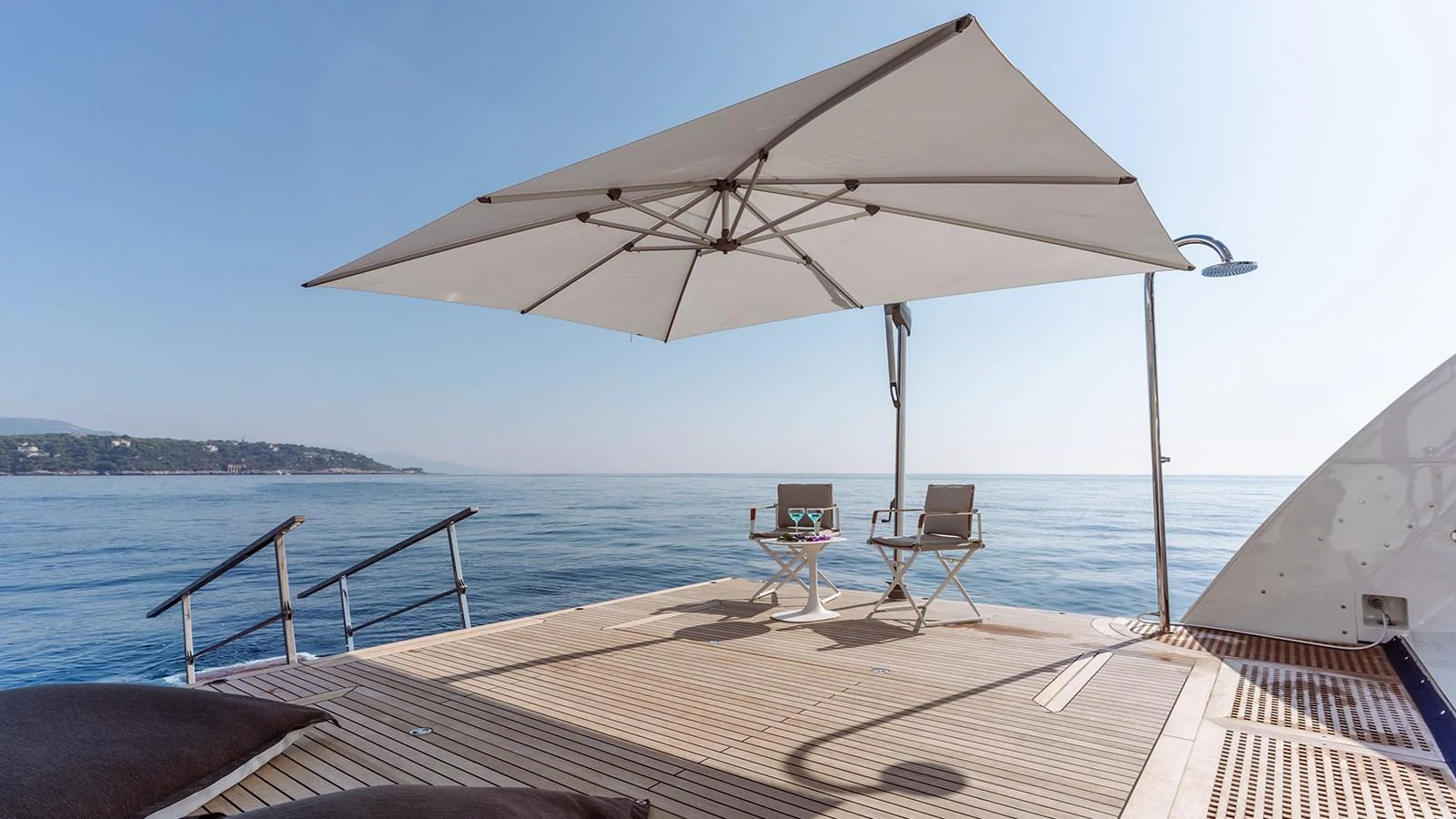 a large umbrella on a boat aboard INCAL Yacht for Sale