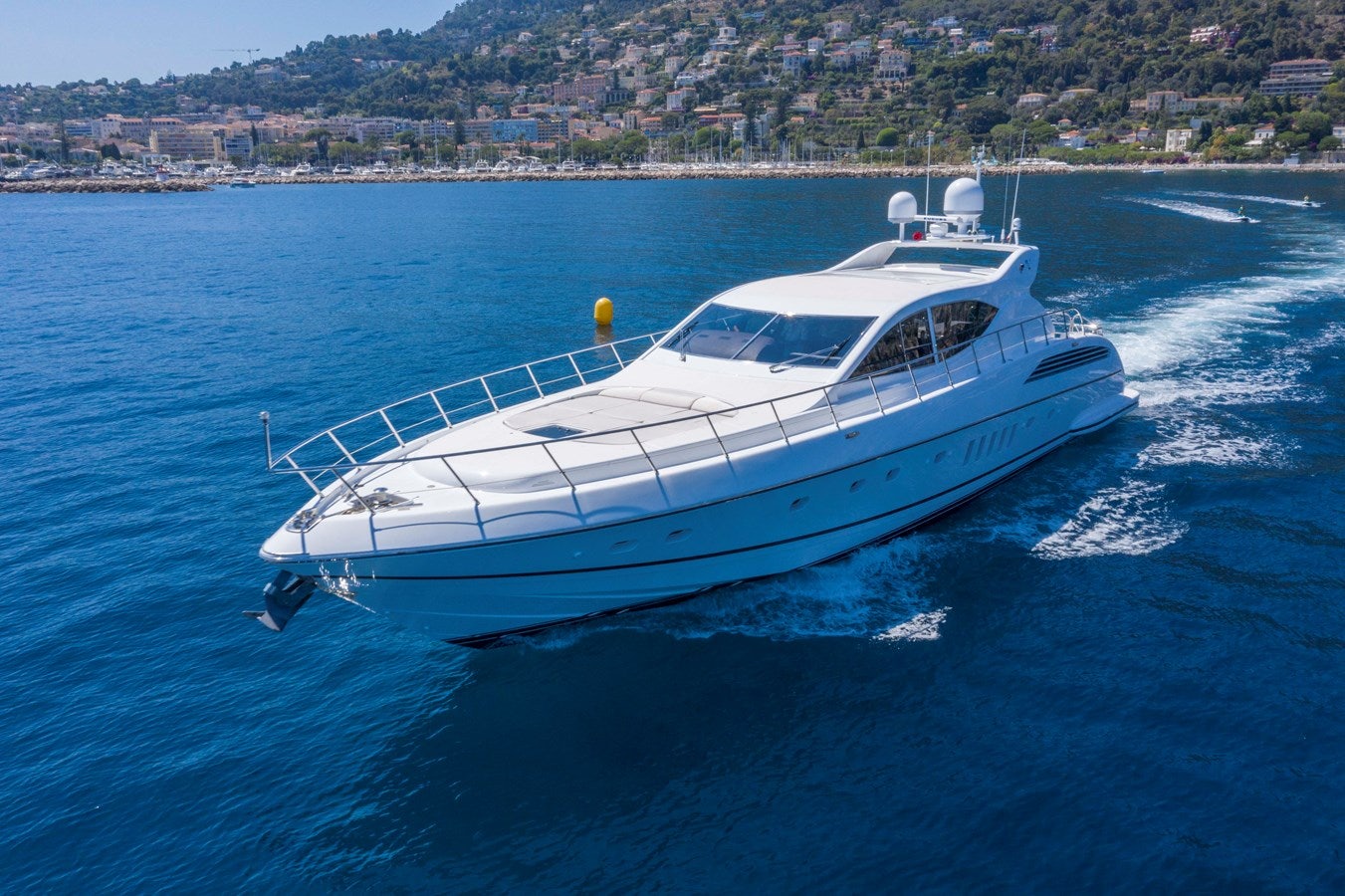 a white boat on the water aboard ULTIMA BEACH Yacht for Sale
