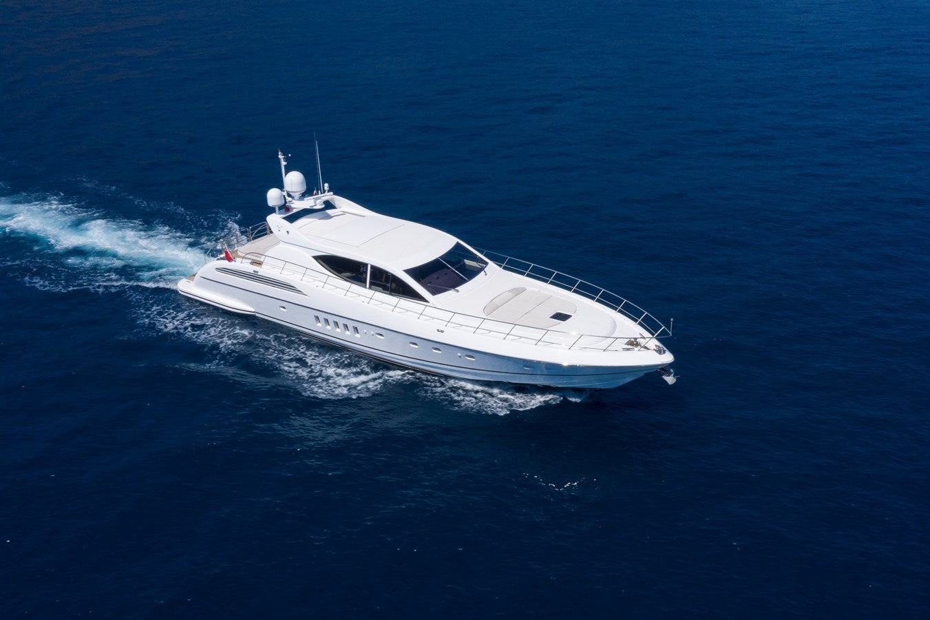 a white yacht in the water aboard ULTIMA BEACH Yacht for Sale