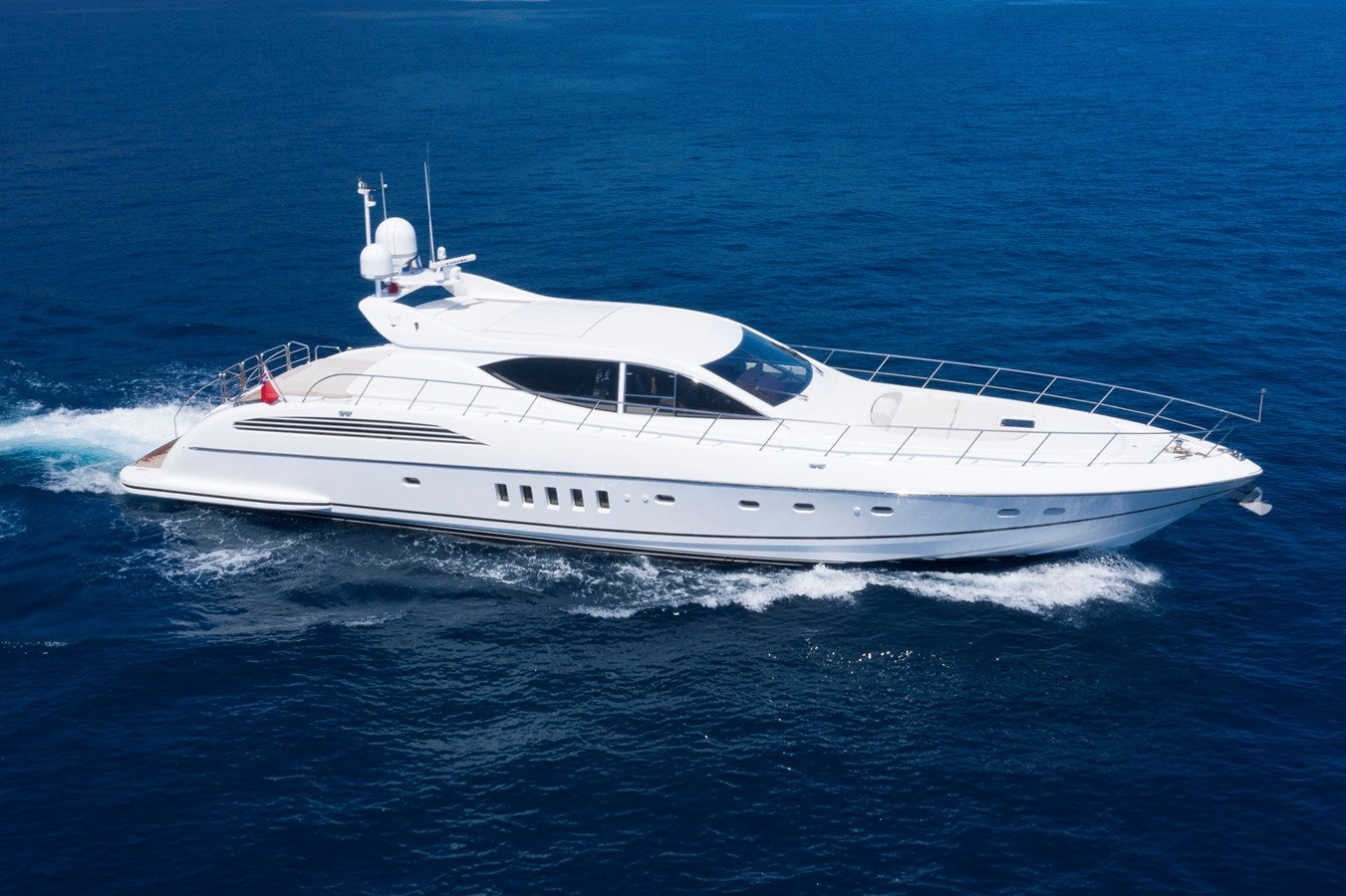 a white yacht in the water aboard ULTIMA BEACH Yacht for Sale
