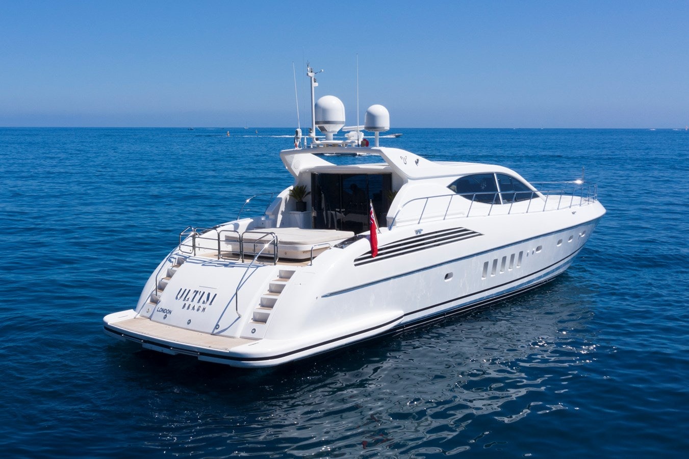 a white yacht in the water aboard ULTIMA BEACH Yacht for Sale