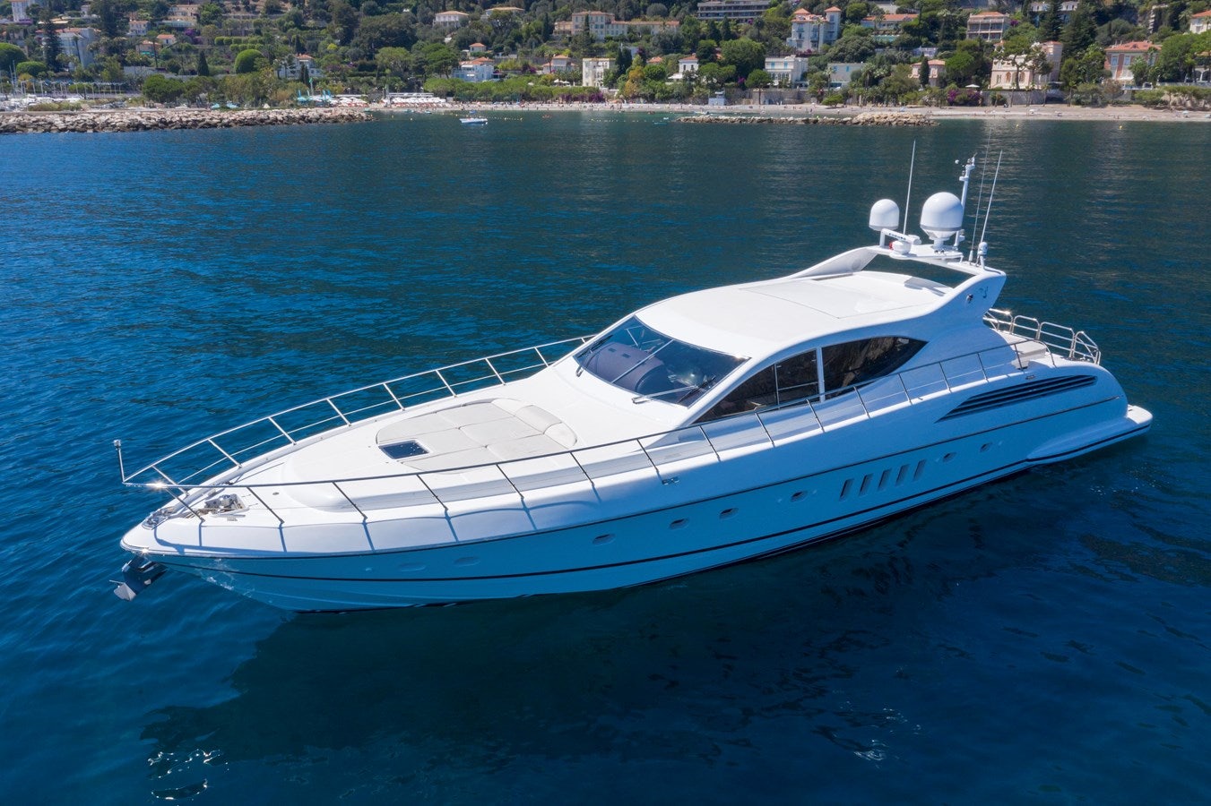 a white boat in the water aboard ULTIMA BEACH Yacht for Sale