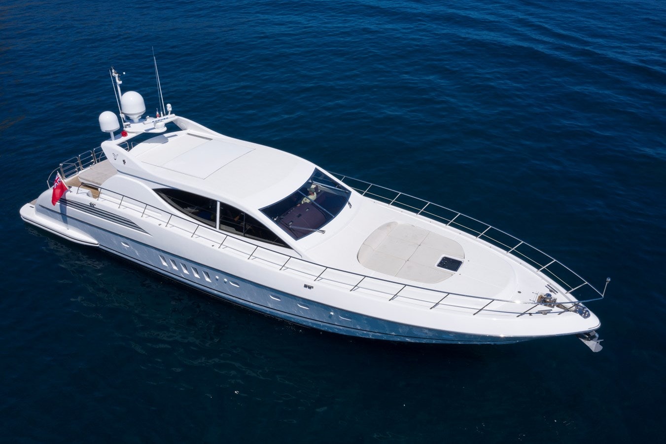a white yacht in the water aboard ULTIMA BEACH Yacht for Sale