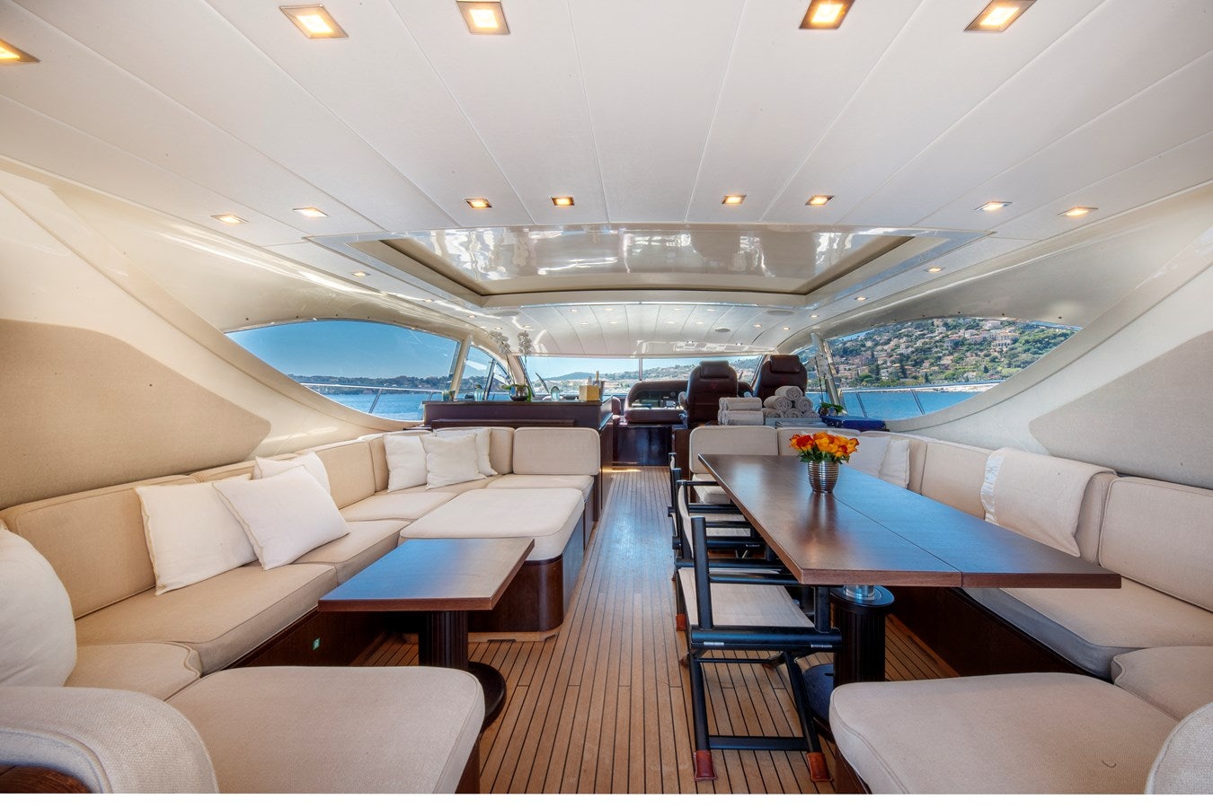 a room with a pool table and chairs aboard ULTIMA BEACH Yacht for Sale