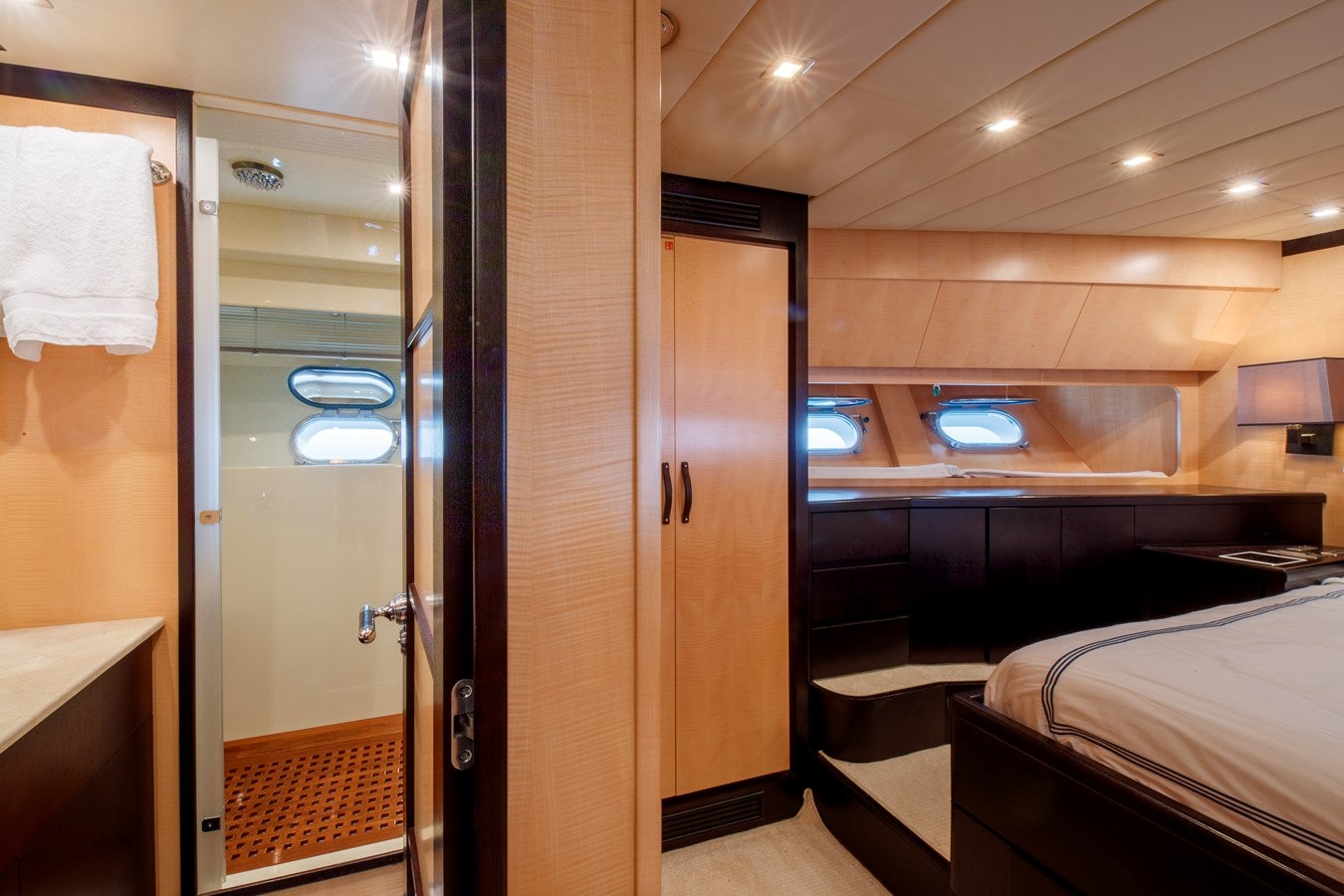 a room with a bed and a mirror aboard ULTIMA BEACH Yacht for Sale