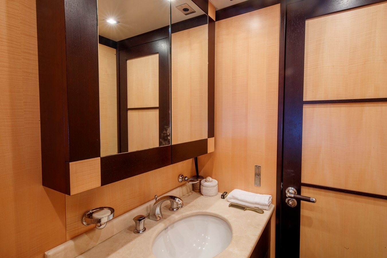 a bathroom with a large mirror aboard ULTIMA BEACH Yacht for Sale