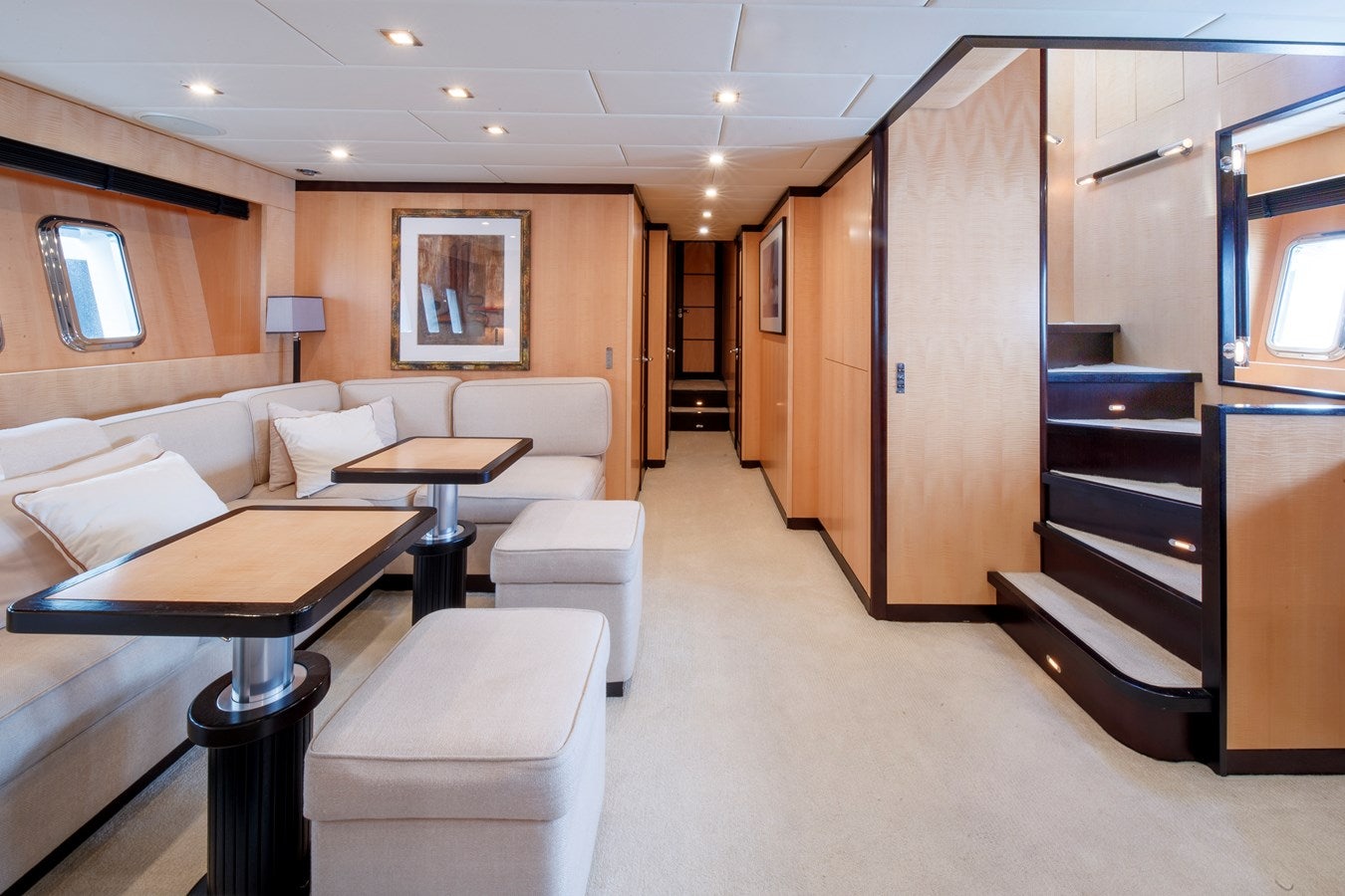 a living room with a couch and a table aboard ULTIMA BEACH Yacht for Sale