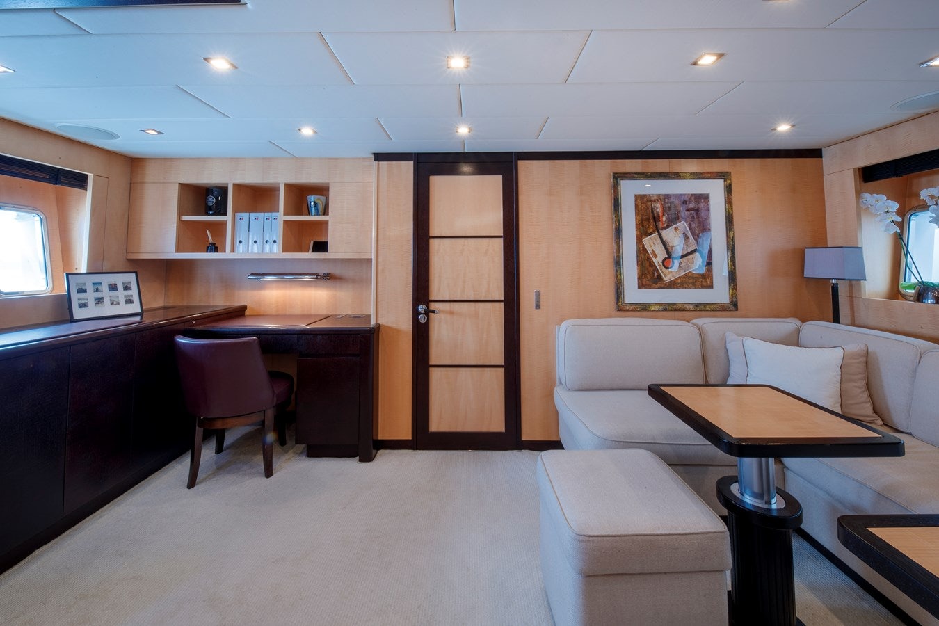 a room with a couch and a table aboard ULTIMA BEACH Yacht for Sale