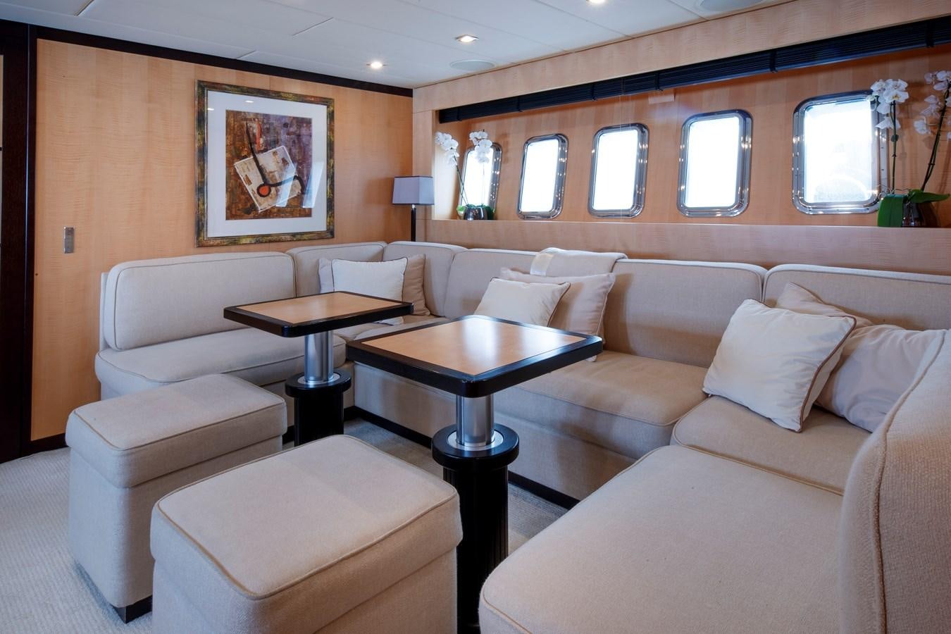 a living room with a couch and a coffee table aboard ULTIMA BEACH Yacht for Sale